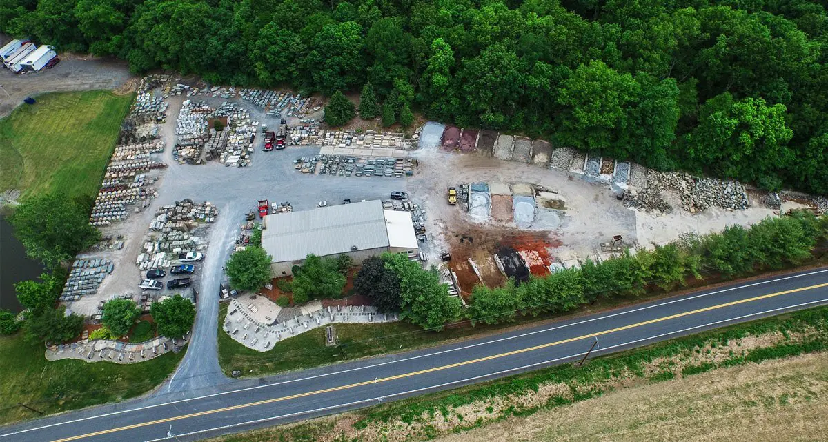 An aerial view of a construction site with trees.